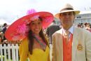 Tracy Rose, a well known milliner, with her husband wearing one of her own creations.