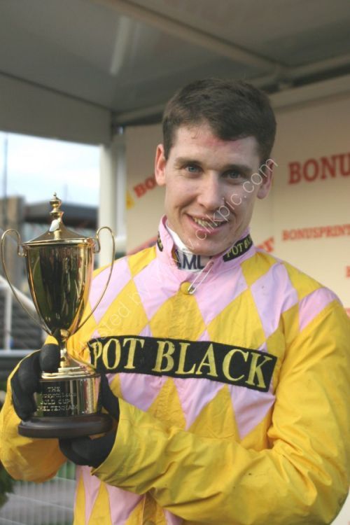 Richard Johnson (Monkerhostin was the horse) with winning trophy at Cheltenham.