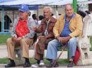 Cubans watching Passersby in Park, Havana