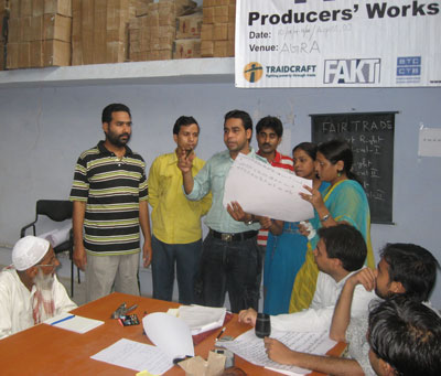Mathew from MESH (left) conducting a Fair Trade Plus Training 