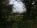 Leaning gate commanding beautiful dawn view over English countryside
