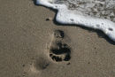 Footprint about to be washed away, Cornwall