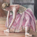 Ballerina tying pointe shoes