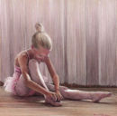 Young Ballerina tying shoes