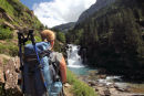 01D-6051 Female Hill Walker on the GR11 Footpath Enjoying the View of a Cascade on the Rio Arazas in the Ordesa Canyon, Pyrenees Spain