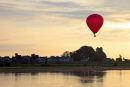 02D-5663 Hot Air Balloon Flying Over the Town of Les Rosiers Sur Loire Just After Sunrise With the Loire River in the Foreground France