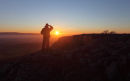 03D-0679 Hill Walker Looking Towards the Setting Sun on Twistleton Scars Yorkshire Dales UK