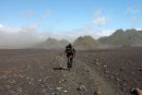 03D-5585 Hiker in the Emstrur Area on Day 3 of the Laugavegur Hiking Trail With Volcanic Dust Storm Behind Iceland