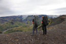 03D-5829 2 Hikers on the Kattarhryggir Ridge in Gooaland Looking Towards the Katla Volcano Which is Covered by Myrdalsjokull Glacier Iceland.