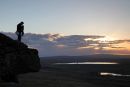 04D-7119 Rock Climber on Goldsborough Crag at Sunset with the Reservoirs of Balderhead and Blackton Behind Baldersdale Teesdale County Durham UK