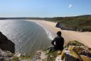 04D-8093 Walker Enjoying the View Over the Golden Sands of Oxwich Bay From Great Torr Penmaen Burrows Gower Wales UK
