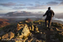 05D-8938 Hill Walker on the Summit of Causey Pike at Sunrise Enjoying the View Towards Skiddaw Lake District Cumbria UK