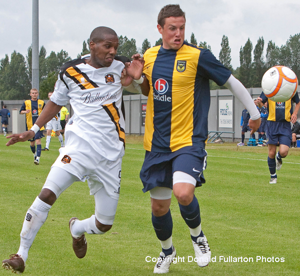 Sons trialist no.9 battles for possession.