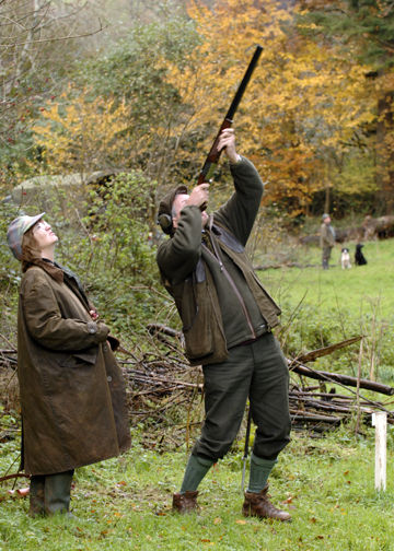 Gun on the peg, taking a high pheasant.