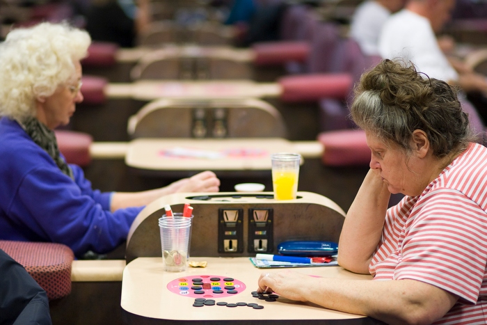 Women concentrate on their bingo cards as the numbers are called at Mecca Bingo in Wandsworth, south London
