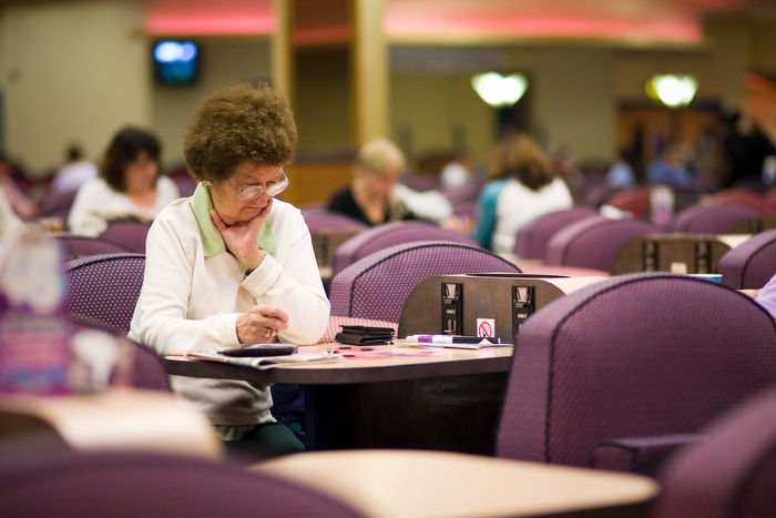 A woman waits for the next bingo call
