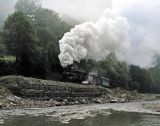 764-421 alongside the river as the mist clears.