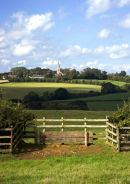 Brampton Ash Church from Stoke Albany with a cross country jump in the foreground
