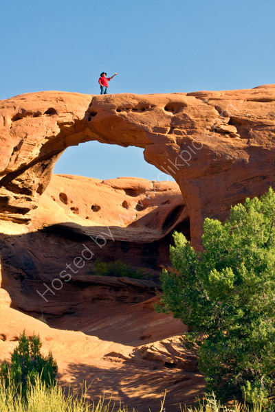 Our Navajo guide, Wayne, again provides a perfect addition to my photograph of another hole in the rocks.