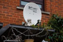 Satellite dish and garden cherub