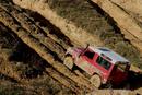 Red Landrover climbing