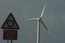 Road sign and windfarm