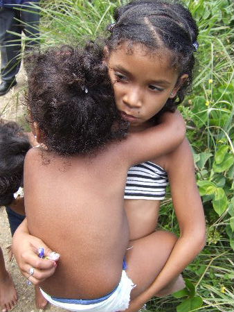 Village child with young sister