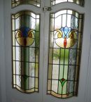 Fully restored double stained glass doors.