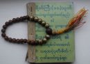 green prayer book and beads 2