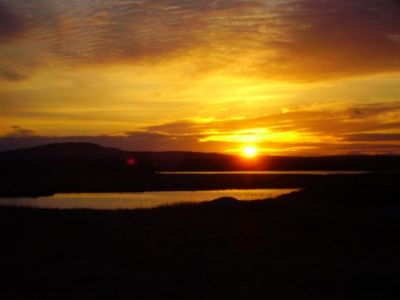 sunrise over benbecula from west coast road