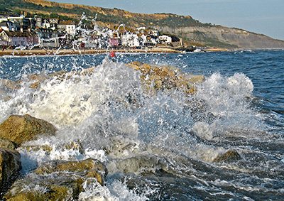 Waves breaking in front of the beach at Lyme Regis, Dorset