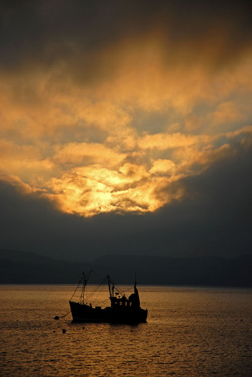Sunrise with fishing boat