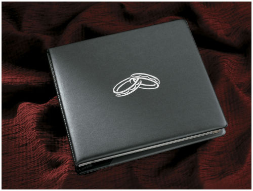 Abigail
<p>Stylish padded traditional album.
<p>Covered in a smooth pearlised Pewter material and is finished tenderly with two interlocking silver wedding bands in the centre of the cover.