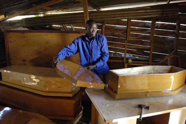 Carpenter making childrens coffins in Lilongwe,Life expectancy in Malawi is around 36 due to the effects of HIV and AIDS