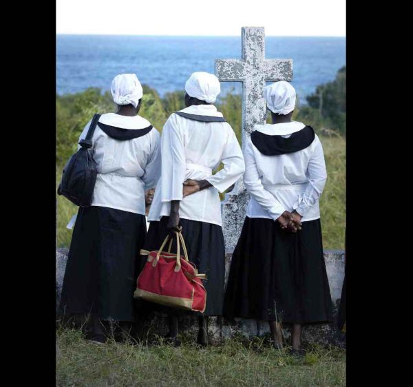Local Malawi Women paying their respects at the gravestone of 19th Century missionaries