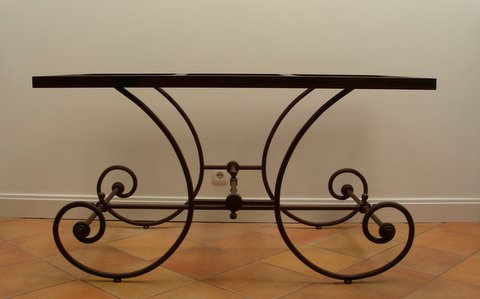 Wrought iron table, rust-coloured with a white marble top. �3000.00
You can select other tops as you prefer. 

Wholesale available for this item. Contact us for more information.
