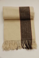 Trip blanket 100% organic wool.Colours: ecru, brown and redSize: 1m80cm x1,40Price: �65