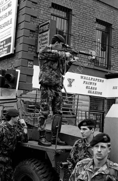 A Brish Army soldier takes aim on the Falls Road