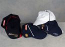 A selection of caps with rhinestone designs on, the black cap has vinyl lettering.