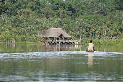 Arriving at Sacha Lodge by dug-out canoe.